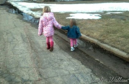 Peanut and Tadpole holding hands